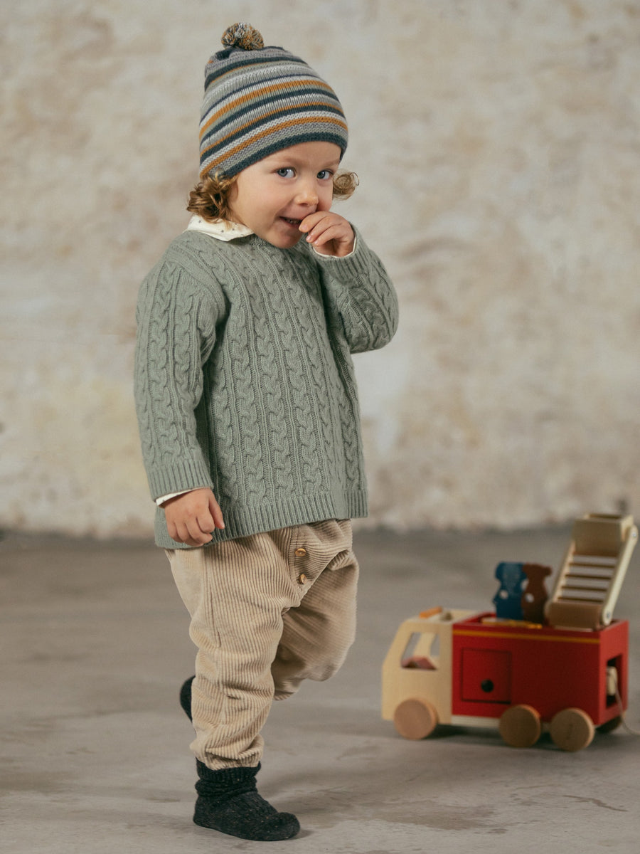 Beanie with pom-pom and embossed stripes